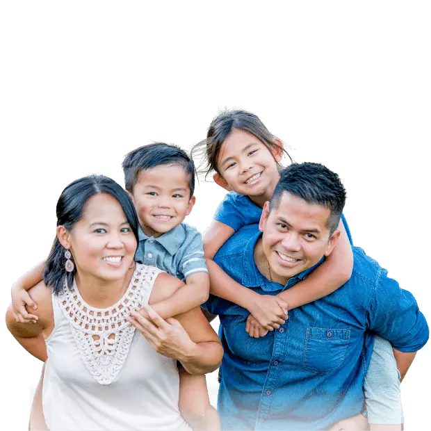A happy family smiling and posing for Loveland Dental in Asheboro, NC with white teeth.